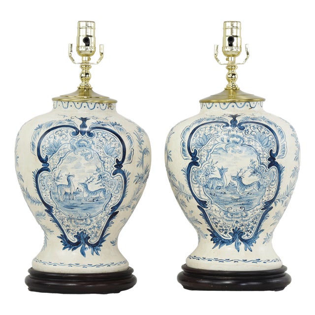 Pair of Vintage Hand Painted Blue and Cream Ceramic Table Lamps With Deer and Floral Folk Art Design For Sale