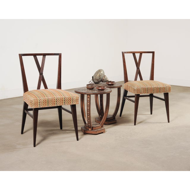 A exceptional pair of Middle Eastern Moorish side or occasional tables clad in dense inlaid mosaic parquetry. Each table...