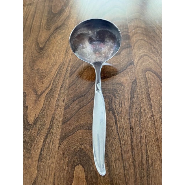 This vintage silverplate sauce ladle by Wm Rogers is a beautiful addition to any collection. Circa 1960, it features the...