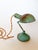 Industrial chic antique turquoise desk or task lamp by Gacor, called the "Handilamp Jr." It has a fold out tab under the...