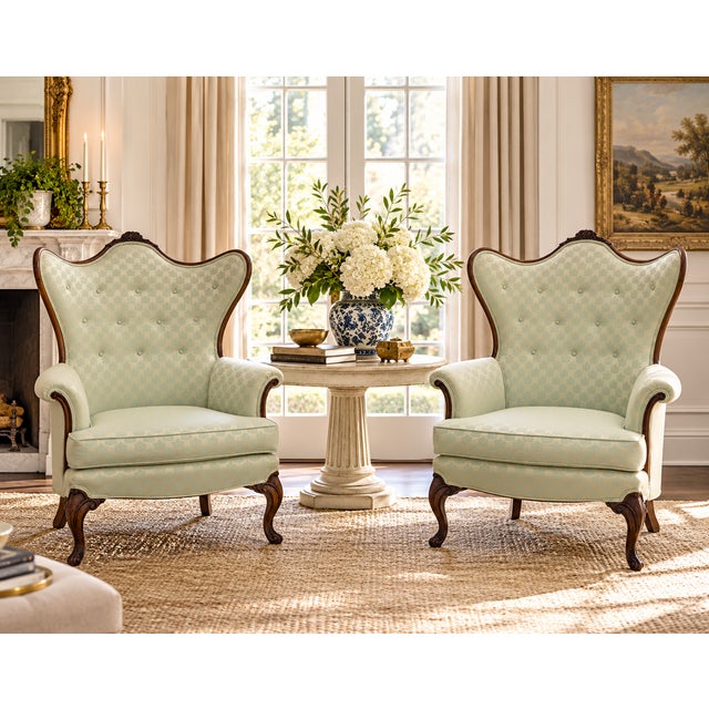 Vintage French Louis XV style carved wood wingback bergère chairs featuring dramatic serpentine backs, exposed carved wood...