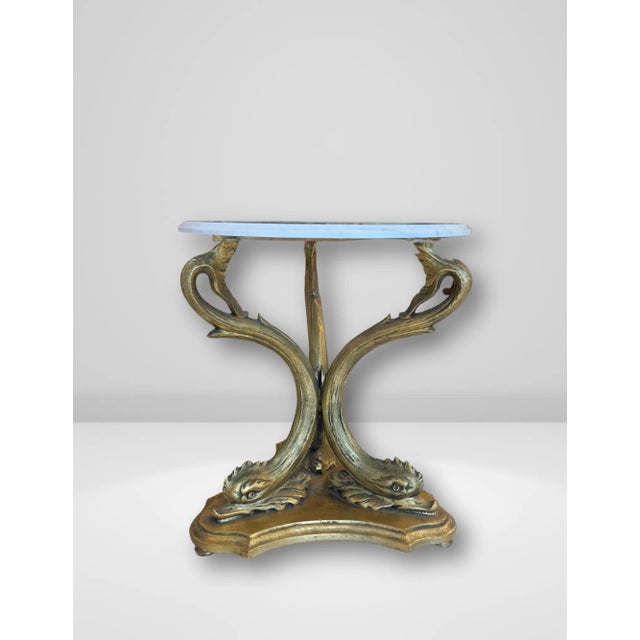 Elevate your space with this exquisite pair of Italian side tables, featuring intricately carved gilded wood tripod bases...