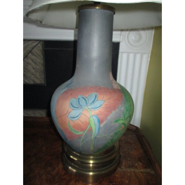 This Chapman hand painted lamp with double-tier brass base, leaf and flower motif in green, slate grey, blush pink, beige...
