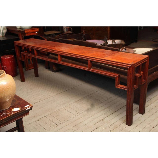 This uncommon elmwood console table was made in China during the early 1900s and features original geometrical design. The...