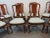 (8) Mahogany Queen Anne Style Dining Chairs, pierced carved backs, upholstered seat, Arm chairs measure chair 27.5 d 24.5w...