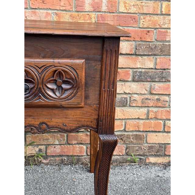 This striking antique French Chevet combines the deep storage capacity of a traditional coffer with the elevated stature...