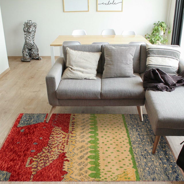 This stunning hand-knotted Afghan Balouchi rug is a captivating addition to any decor. Crafted by skilled artisans, it...