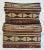 Vintage pair of woven reed baskets in natural tone with black patternwork throughout. Largest measures 9"W X 5"D X 6"H and...