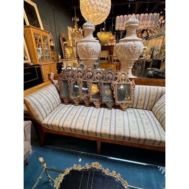 This set of 6 18th century Italian carved mirrors exudes an air of elegance. Each mirror is intricately detailed with...
