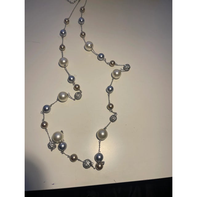This is part of Chairish’s Costume Jewelry assortment. different pearl colors of white, beige, grey and cz balls on long...