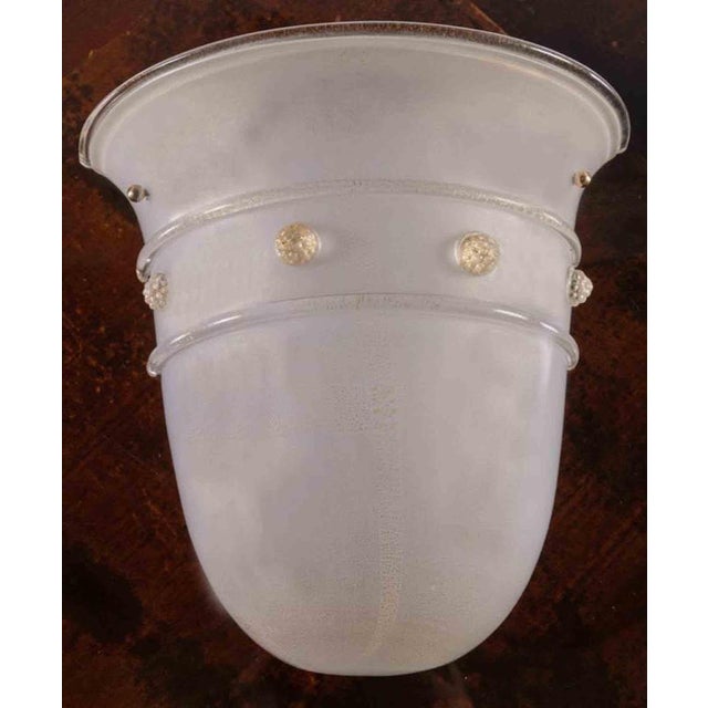 Barovier & Toso, Large one-light sconce in white milky glass, Murano, 1980s. Inclusions in gold dust, hot-applied relief...