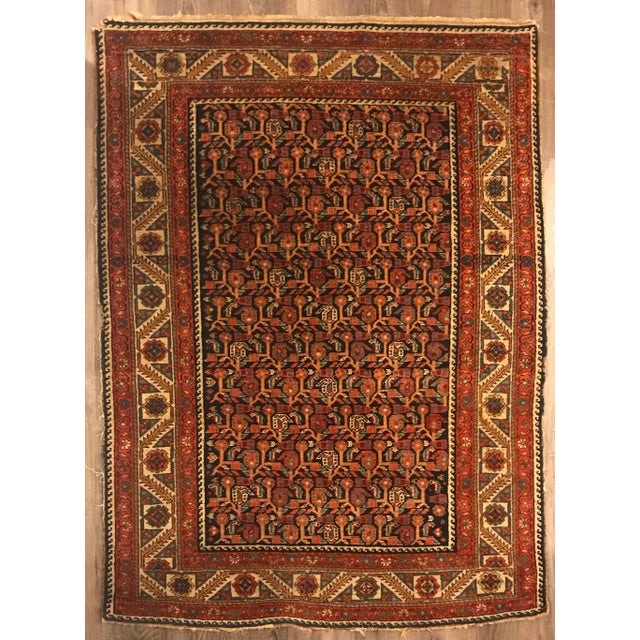 This gorgeous, hand-knotted antique Persian wool rug is from the small town of Malayer of the Hamedan region. It has a...