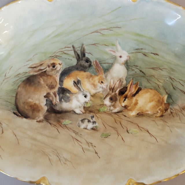 A charming antique Haviland Limoges porcelain platter, hand-painted in France circa 1900 with a delightful gathering of...