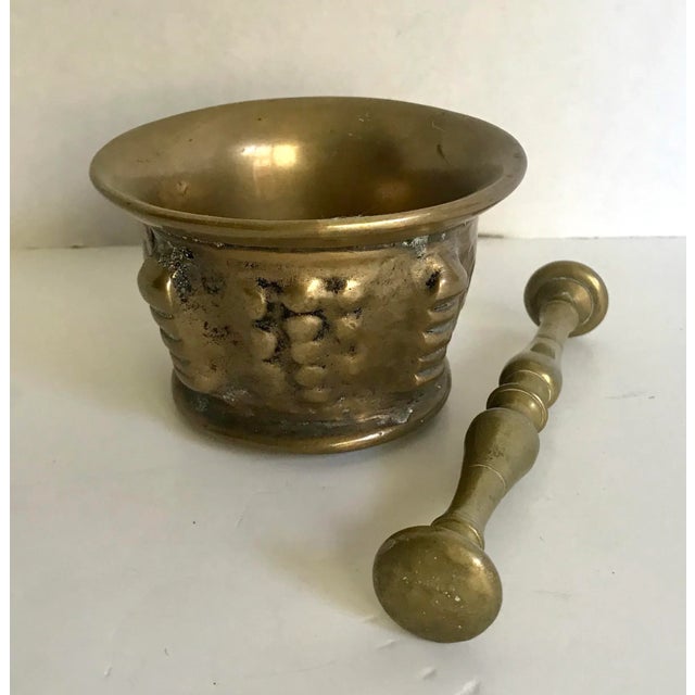 Here is a beautiful antique solid brass mortar and pestle set. The mortar has a cylindrical shape with slightly rounded...