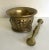 Here is a beautiful antique solid brass mortar and pestle set. The mortar has a cylindrical shape with slightly rounded...