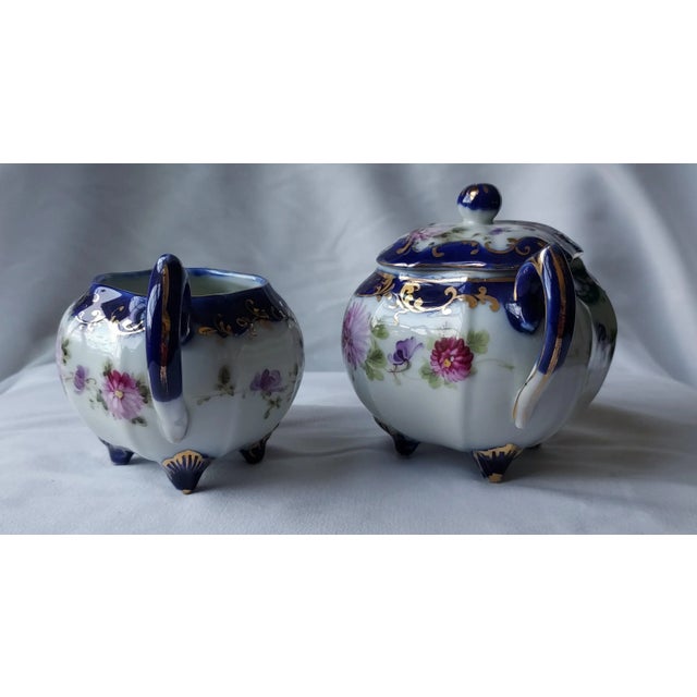 Delicate cobalt and gold painted Nippon porcelain sugar and creamer set acquired from an auction house in Loganville, GA...
