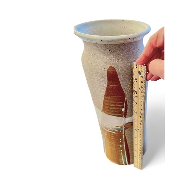 This mid-century American studio pottery set features hand-thrown stoneware vessels with organic modern forms and warm,...