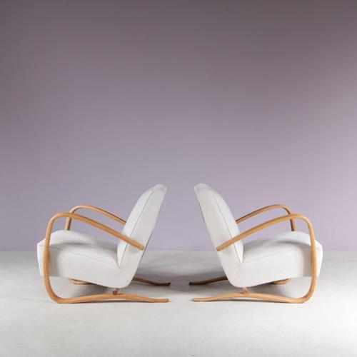 An iconic pair of lounge chairs in eye-catching Czech design by Jindrich Halabala, manufactured by Up Zavody in the Czech...