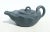 Deep green clay non-glazed Hsi Shing teapot formed as a lotus leaf on a stem with a small leaf lid. Bearing stamps to the...