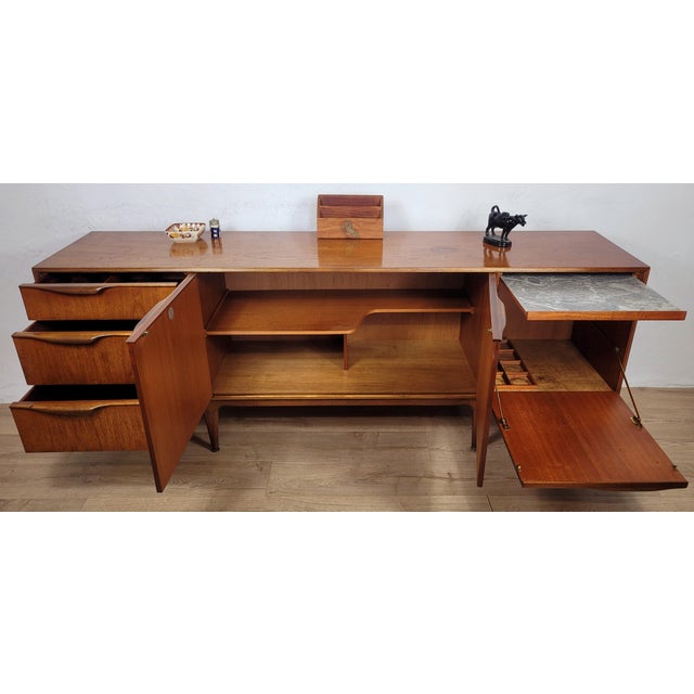 This is a very collectable and desirable original 'McIntosh' sideboard, that exudes a gorgeous Mid 20th-Century style to...