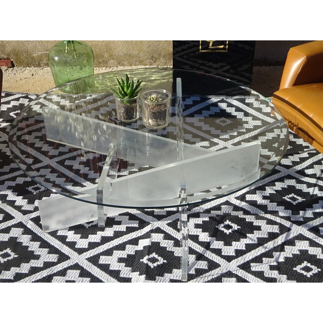 Designer coffee table in 8mm thick tempered glass with polished and beveled edges. 100cm diameter top on a 40cm high...