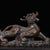 This finely cast piece depicts a fierce guardian creature, likely a Pixiu or a stylized guardian lion, in a crouching,...