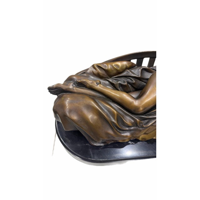 Bill Mack’s Tranquility, dated 1996, is a limited-edition figurative sculpture depicting a reclining female nude resting...
