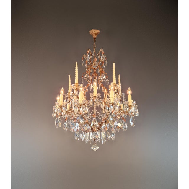 This crystal chandelier is designed in the Italian Baroque style with Rococo influences. Its curved shape, floral details,...