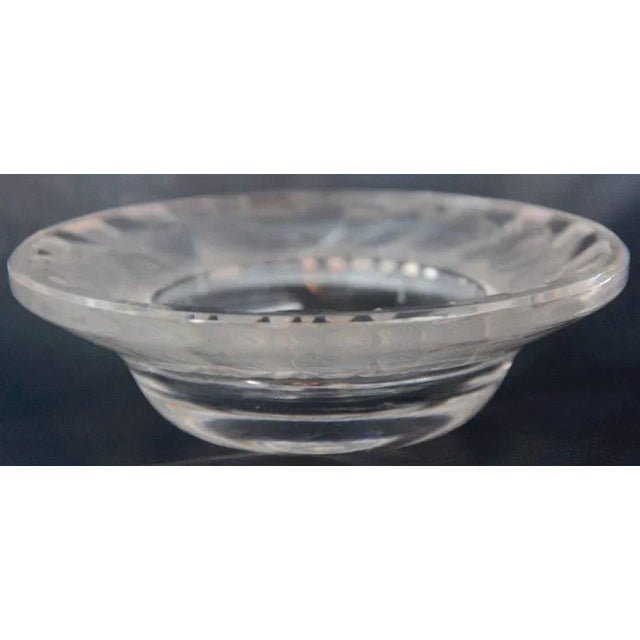A ring of tiny sparrows are running around the rim of this Lalique of France pin dish. The dish is named Irene. The...