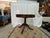 An extraordinary masterpiece of artisan craftsmanship, this Regency-style circular center or breakfast table is...