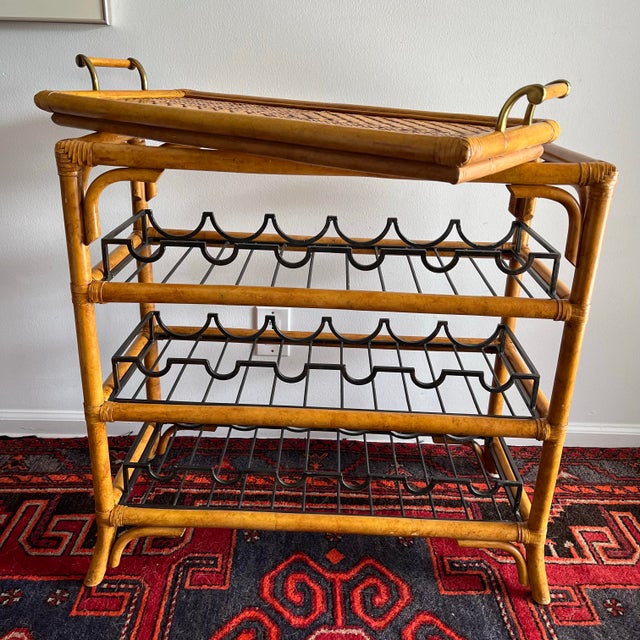 Maitland-Smith Rattan & bamboo serving table with wine storage. The removable tray top has beautiful brass colored...