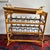 Maitland-Smith Rattan & bamboo serving table with wine storage. The removable tray top has beautiful brass colored...