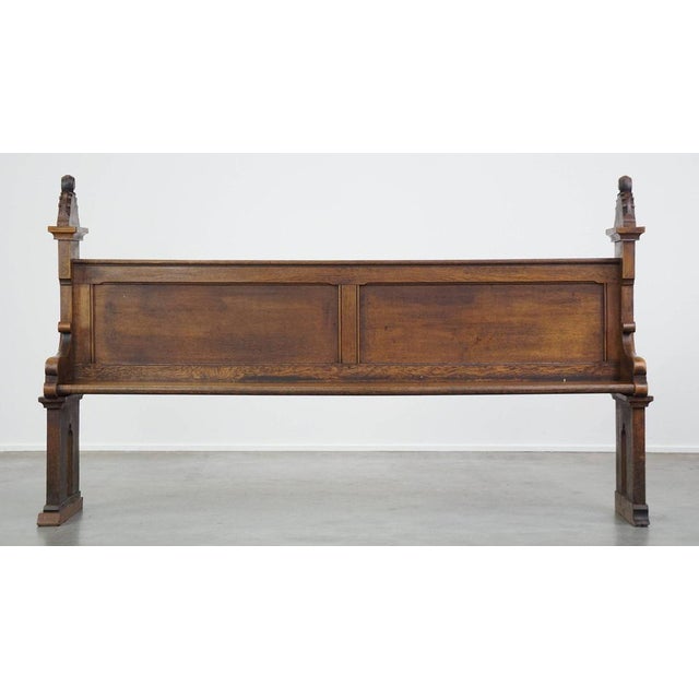 This great, beautifully carved antique oak church pew in Gothic style from the late 19th century. This great antique...