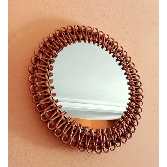 This rattan round mirror is attributed to Franco Albini for form and style. No damages. 100% original without defects....