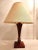 A teak table lamp by Restoration Hardware that pairs well with Mid-century style furniture. The lamp shade is included and...