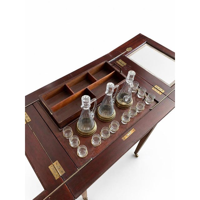 A beautiful Art Deco drinks table—also known as a mechanical pop-up bar table—with hinged leaves and an internal fitted...