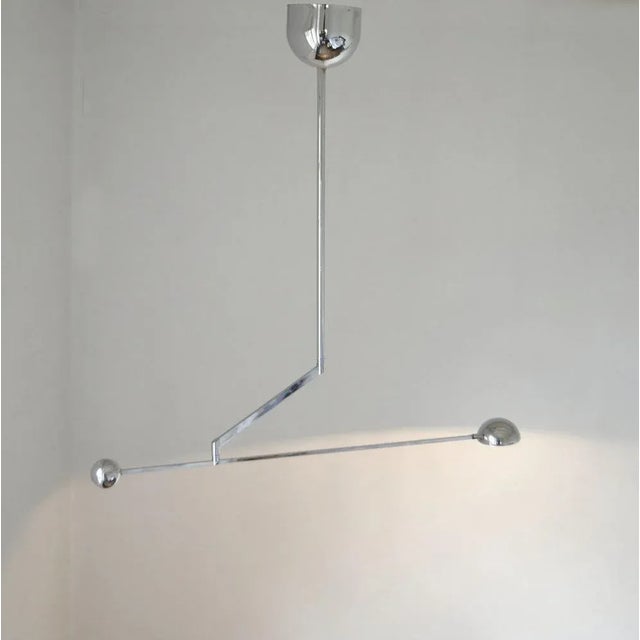 Minimalist counterbalance chrome pendant lamp with spotlight is super flexible, with an arm adjustable to 180 degrees. The...