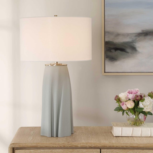 The Cover Up Table Lamp Features A Gracefully Sculpted Ceramic Base, Reminiscent Of Softly Draped Fabric, In Muted Light...
