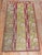 An authentic small late 19th centuryTurkish Ghiordes runner with a floral motif. Measures: 3'6'' x 7'.