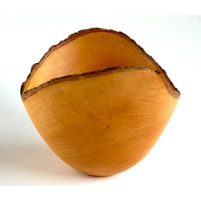 This deep, hand turned Hawaiian Jacaranda wood bowl has asymmetrical sides and a buttery smooth finish.