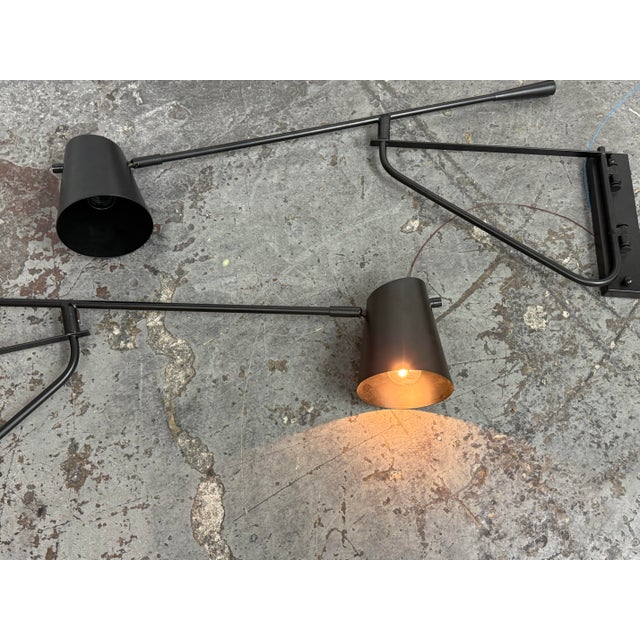 Design Plus Gallery presents a Pair of Swing Arm Sconces from Michael Oren Designs. These matching sconces are made of...