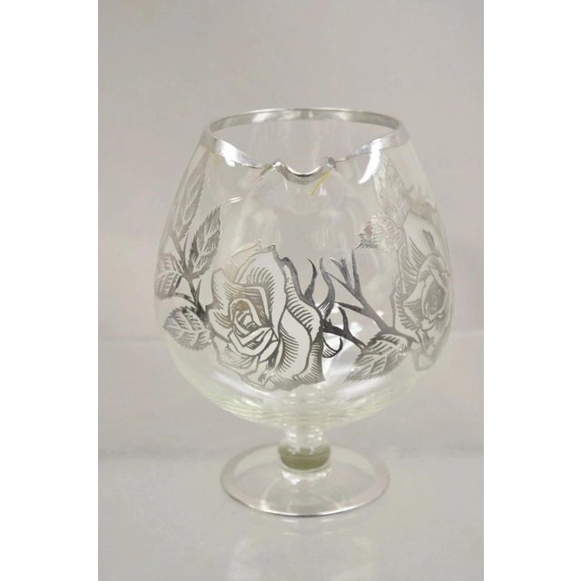 Vintage Art Nouveau Floral Sterling Silver Overlay Glass Footed Water Pitcher. Item features blown glass base, sterling...