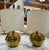 Add a touch of vintage charm and sophistication to your space with this pair of table lamps featuring polished brass...