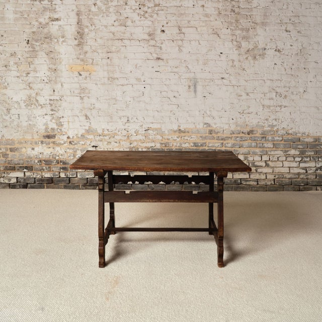 Add timeless French character to your space with this 19th century French wooden table, a beautifully crafted piece that...