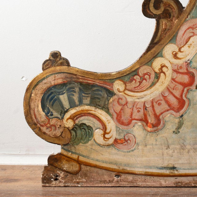 Original hand-painted and carved Italian wooden architectural wall panel or decorative door accent featuring an armorial...