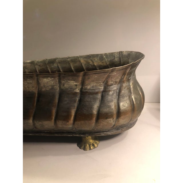 This fabulous 1960s Oblong Copper Planter With Brass Claw Feet will be a standout on your kitchen counter filled with...