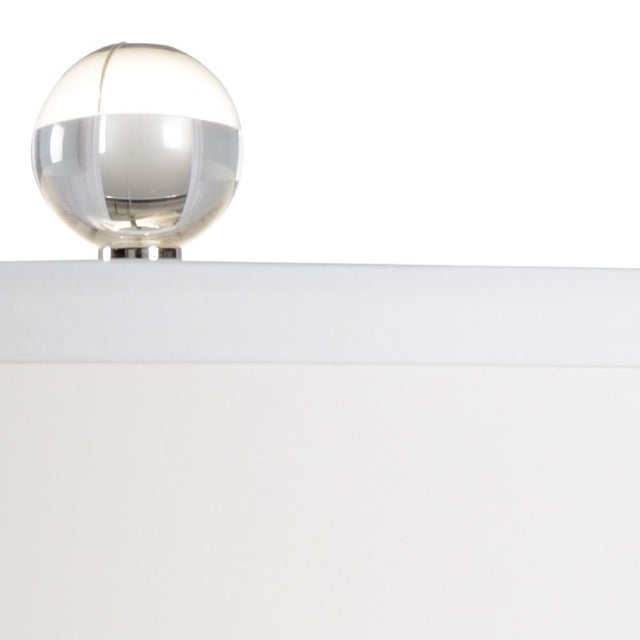 Lapis lamp is a stunning mouth blown italian glass vase on an acrylic mounting with french wiring. Topped with an off...