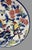 This vintage platter from Japan features hand-painted colorful floral and bird designs, with a round shape and a diameter...