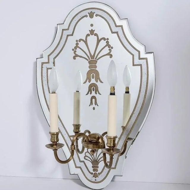Just in! This pair of French , c.1940-1950, two-arm bronze mirrored eglomise etched shield shape, two candle light wall...