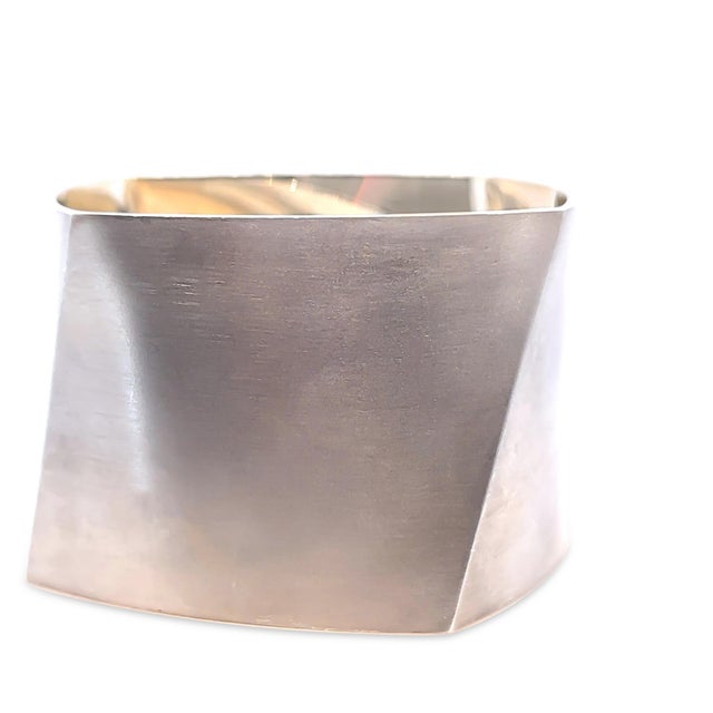 A rare vintage Tiffany & Co. Frank Gehry Torque cuff bangle crafted in sterling silver, showcasing the celebrated...